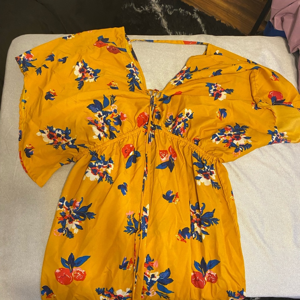 yellow floral halter dress is by the artisanal clothing label America & Beyond